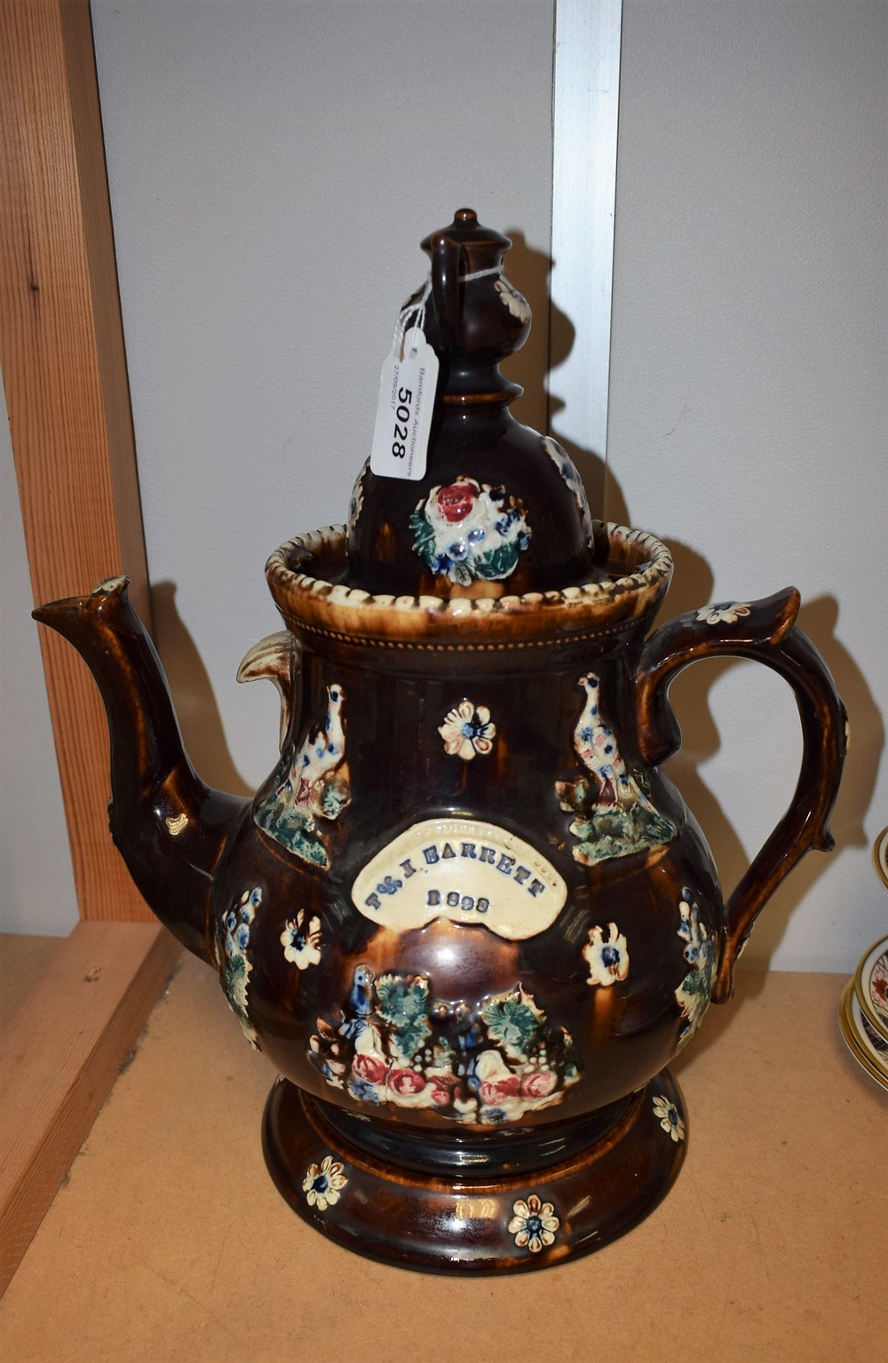 A 19th century barge teapot and stand,