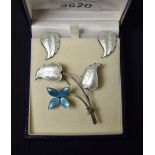 Ivar T Holth - a Norwegian silver and enamel flower brooch and conforming leaf earrings suite,