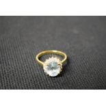 A pale blue stone, diamond and white sapphire cluster ring, 9ct gold shank, stamped QVC 375, 9k,