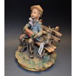 A Naples Capodimonte figure, Concertina Player with Dog,