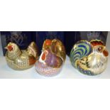 A Royal Crown Derby paperweight, event piece Farmyard Hen, boxed, gold stopper; Cockerel, boxed,