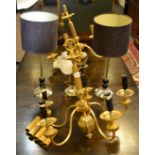 A pair of contemporary gilt five arm chandelier's; a pair of gilded Neo Classical style table lamps,