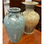 A large floor standing contemporary baluster shaped vase;