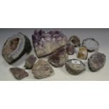 Geology - a purple amethyst quartz specimen; another smaller; a split agate geode;