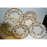 A set of four Royal Crown Derby, Royal Antoinette pattern , wavy edged plates,