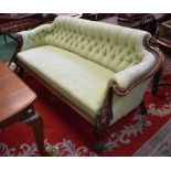 A substantial Victorian mahogany sofa, boldly carved with acanthus scrolls,