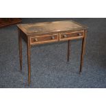 An Edwardian satinwood crossbanded mahogany writing table, retailed by Eddershaws House Furnishers,