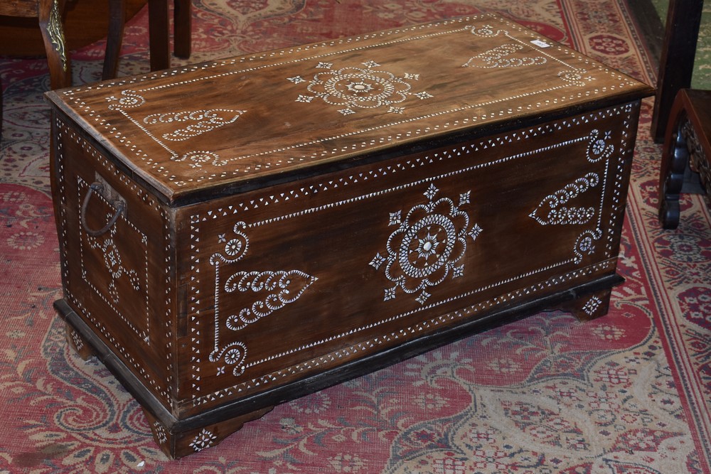 A Moorish north African hardwood blanket chest inlaid with mother of pearl.