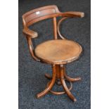 An early 20th century rise and fall bentwood office chair, c.