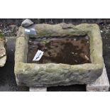 A 19th century Derbyshire gritstone trough, 21cm high, 60cm long,