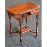 A late Victorian mahogany occasional table, carved and turned legs,