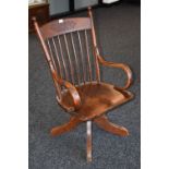 A late 19th century oak rise and fall office chair, c.