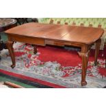 A Victorian mahogany pull out dining table