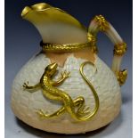 A Royal Worcester blush ivory jug, gilt branch handle, surmounted with a gilt lizard,