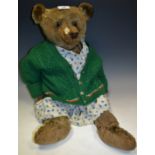 An early 20th century Teddy Bear, probably Steiff, gold mohair body, small hump back,