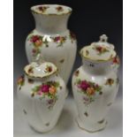 Royal Albert Old County Roses - a pair of lidded urn vases; another larger;