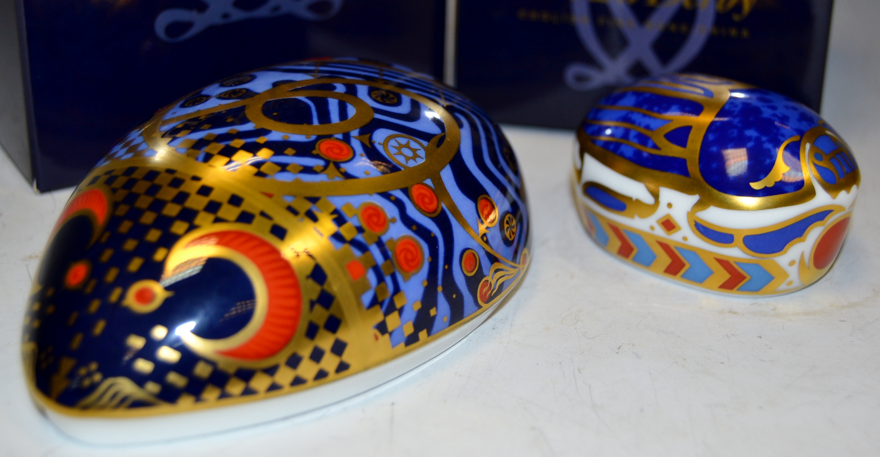 A Royal Crown Derby paperweight , Computer Mouse, boxed, gold stopper; Millenium Bug, boxed,