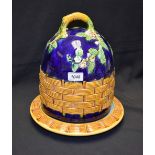 A Majolica beehive cheese dome and stand, decorated with foliage and hurdling,