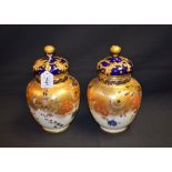 A pair of Royal Crown Derby vases and covers,