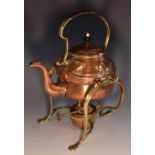 An Art Nouveau copper and brass tea kettle on stand,