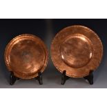 A Hugh Wallace circular plainished copper dish, chevron border, slightly dished centre, 22.