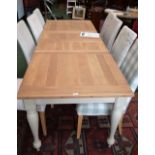 A large modern oak extending dining table and eight modern upholstered ding chairs (9)