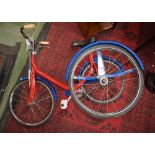 A Raleigh type tricycle, hard tyres, restored, c.