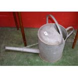 A vintage galvanized watering can.