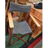 A pair of beech folding directors chairs, canvas backs and seats,