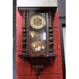 A mahogany Vienna wallclock. C.