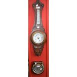 An oak cased Aneroid barometer with thermometer; an Art Deco style barometer,
