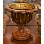 A Victorian style ice bucket, brass liner in slatted basket.