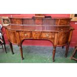 A George III breakfront mahogany sideboard, two tambour door cupboard to top,