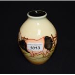 A contemporary Moorcroft vase tube lined with pigs,