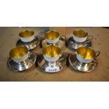 A set of six comport porcelain and silver metal coffee cans,