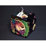 A contemporary Moorcroft two handled biscuit barrel and cover, tube lined with figs,