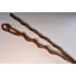 Tribal Art - an African staff or walking cane, carved as a stylised snake,