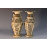 A pair of Chinese ivory hexagonally panelled ovoid vases,