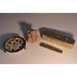 A Chinese silver backed clothes brush, embossed with prunus blossom and song bird, 18cm wide,