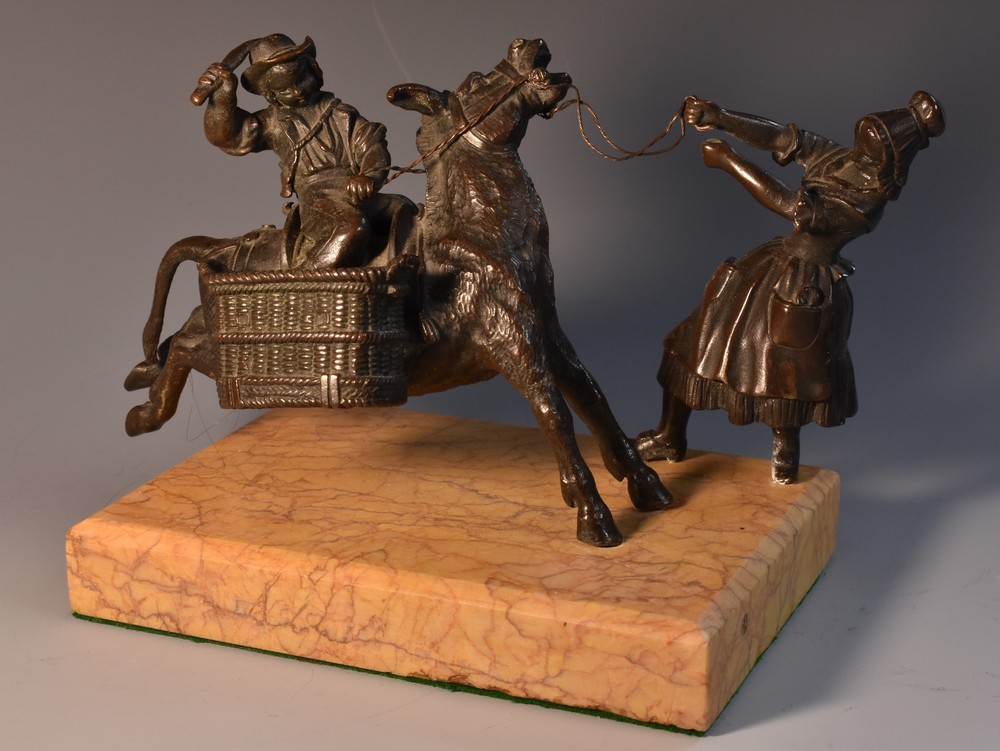 A 19th century dark patinated bronze table vesta, cast as a stubborn mule, steadfast,