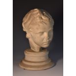 A museum-type plaster library model, head of Eros, marked Antiksan, Turkye,