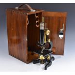 A brass and black painted monocular microscope, by Watson & Son, London, rack and pinion adjustment,