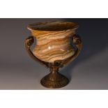 A 19th century French bronze and banded onyx campana mantel vase, scroll handles,