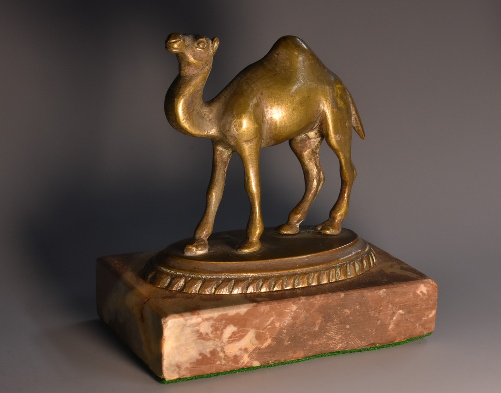 A bronze desk model, of a camel, rectangular marble base, 9.