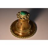 A 19th century malachite mounted gilt brass inkwell, hinged cover set with a cabachon,