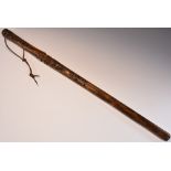 A Folk Art walking cane or baton, the shaft carved in relief with naval and military motifs,
