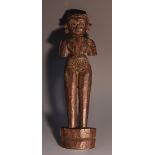 An Indian hardwood votive doll, carved as a stylized female figure, 22.