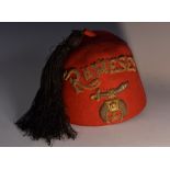 An early 20th century Egyptian fez, embroidered and appliqué in gilt and silvered threads,