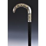 A French Art Nouveau period silver-mounted ivory walking cane, curved handle pierced with tracery,