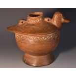 A pre-Columbian terracotta vessel, in the form of a stylized bird, 'Vitruvian' scroll borders,